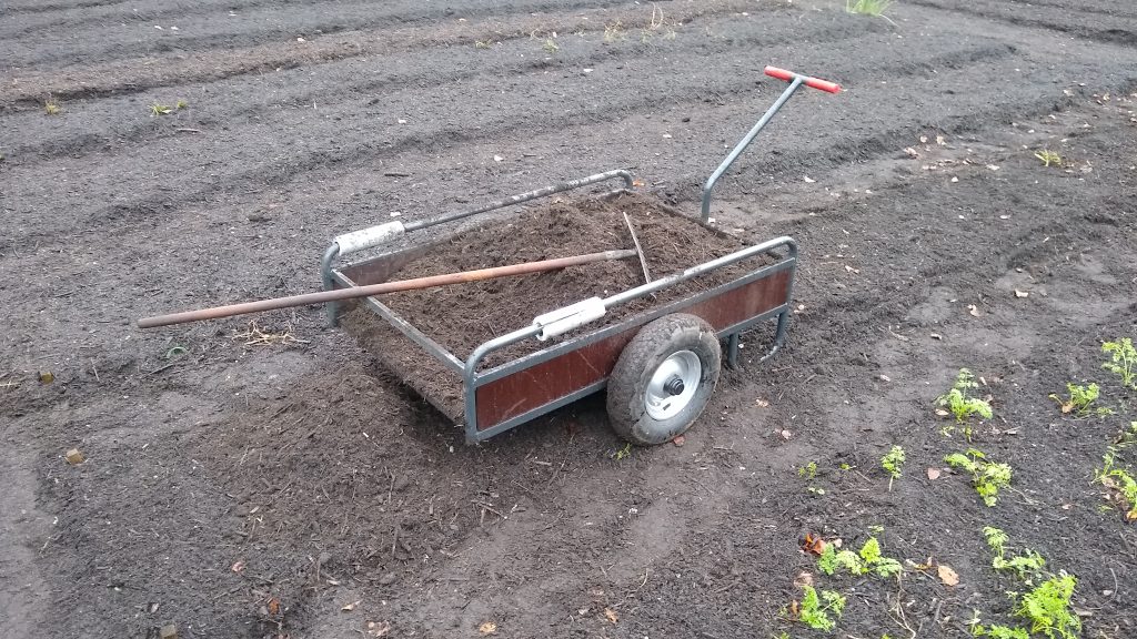 Compost cart with width of beds