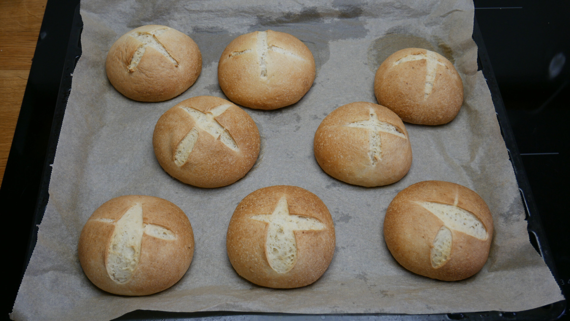 baked bread rolls on a baking tray